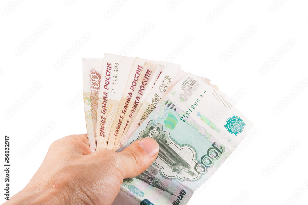 Hand with russian rubles on the white background Hand with russian rubles on the white background