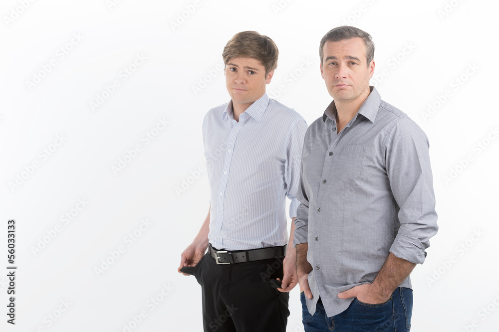 Looking for a job. Two depressed men looking at camera while sta Looking for a job. Two depressed men looking at camera while sta
