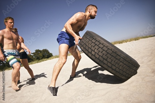 Tough crossfit workout on beach