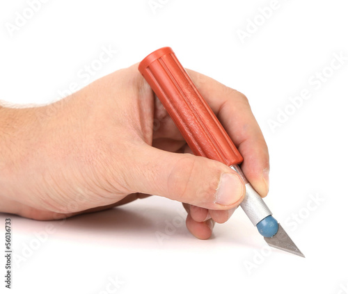 Hand holds plastic Craft Knife photo