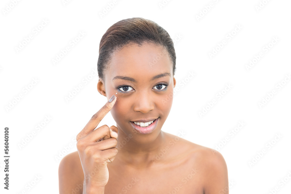 Beautiful model pointing at her eye Beautiful model pointing at her eye