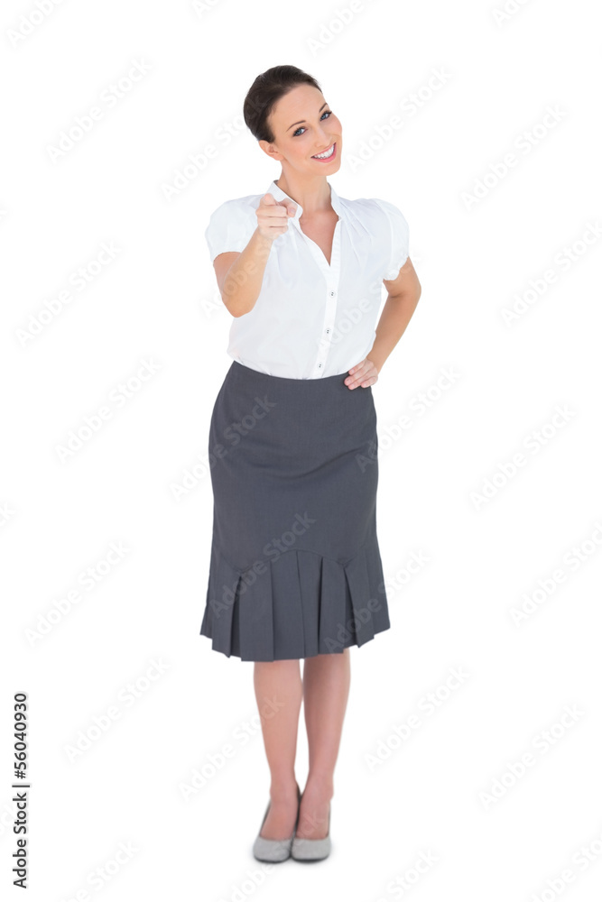 Smiling stylish businesswoman pointing at camera Smiling stylish businesswoman pointing at camera