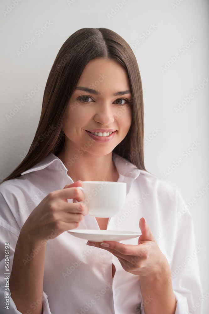 Beauty drinking coffee. Beautiful young woman drinking coffee an Beauty drinking coffee. Beautiful young woman drinking coffee an
