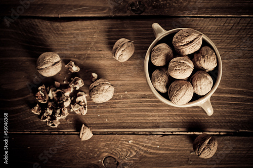 Walnuts on wooden boards. Vintage Retouch.