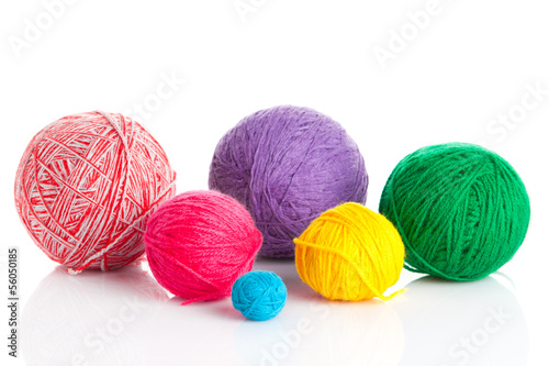 colorful different thread balls. wool knitting on white backgrou