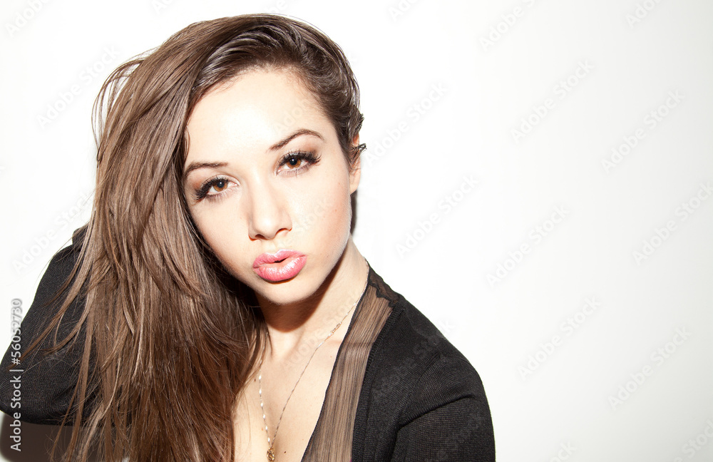 Portrait of beautiful young woman with brown hair - obrazy, fototapety, plakaty 