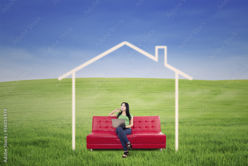 Thoughtful female in dream house outdoor Thoughtful female in dream house outdoor