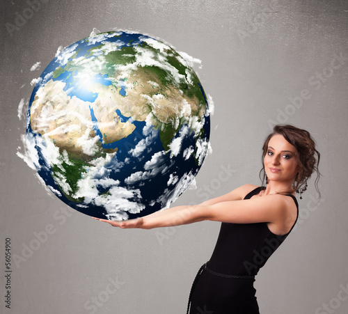 Pretty girl holding 3d planet earth photo