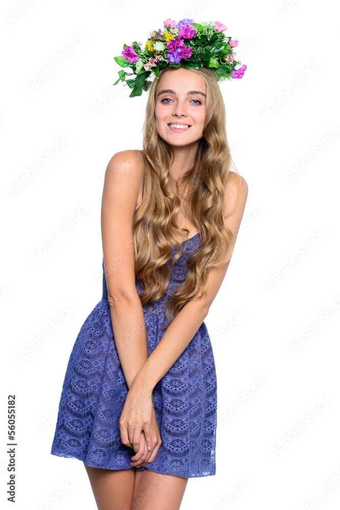 Naklejka premium portrait of a young girl with long hair and flowers on the head