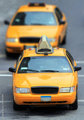 Vászonkép yellow cabs in city
