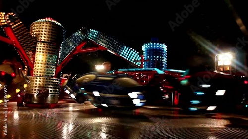 Carousels in amusement park at night