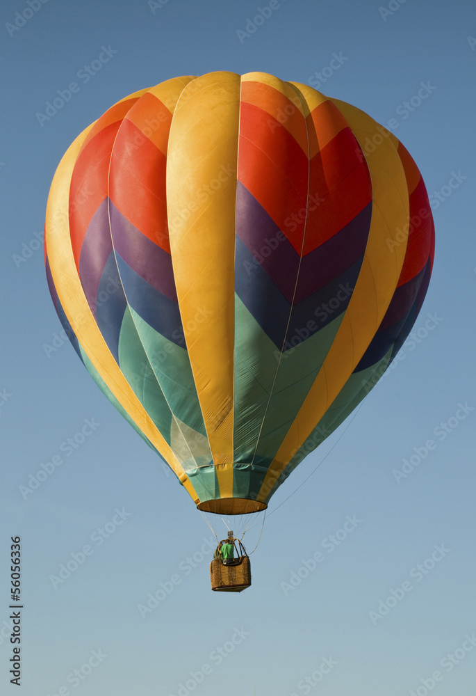 Fototapeta premium Hot-air balloon floating in a blue sky