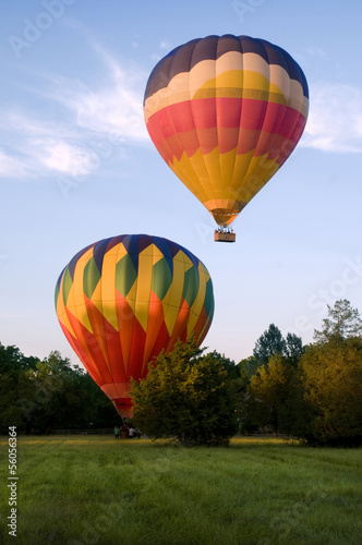 Two hot-air balloons taking off or landing
