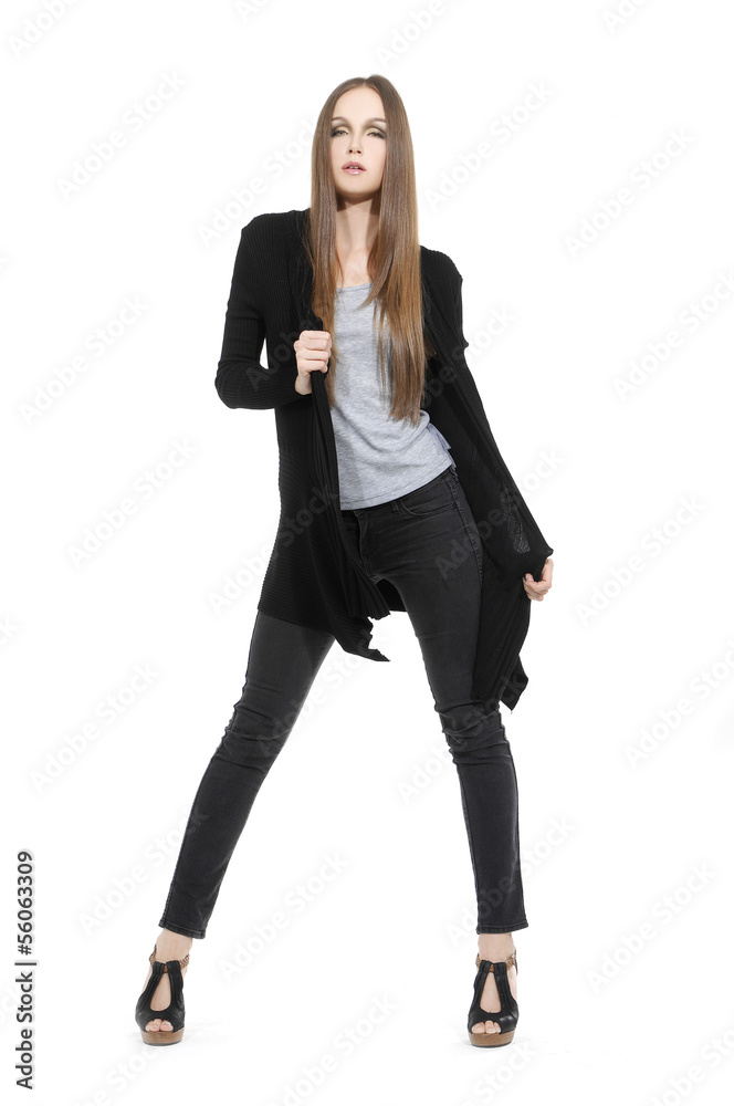 Full length The young long-haired girl posing in studio Full length The young long-haired girl posing in studio