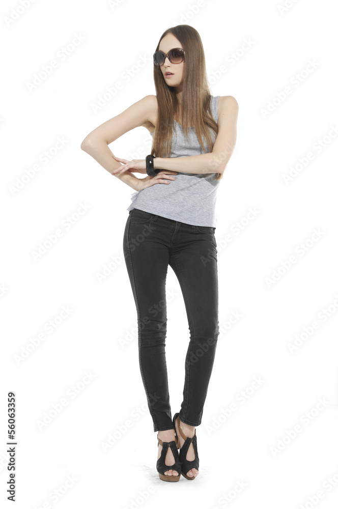 Full length The young long-haired girl posing in studio Full length The young long-haired girl posing in studio