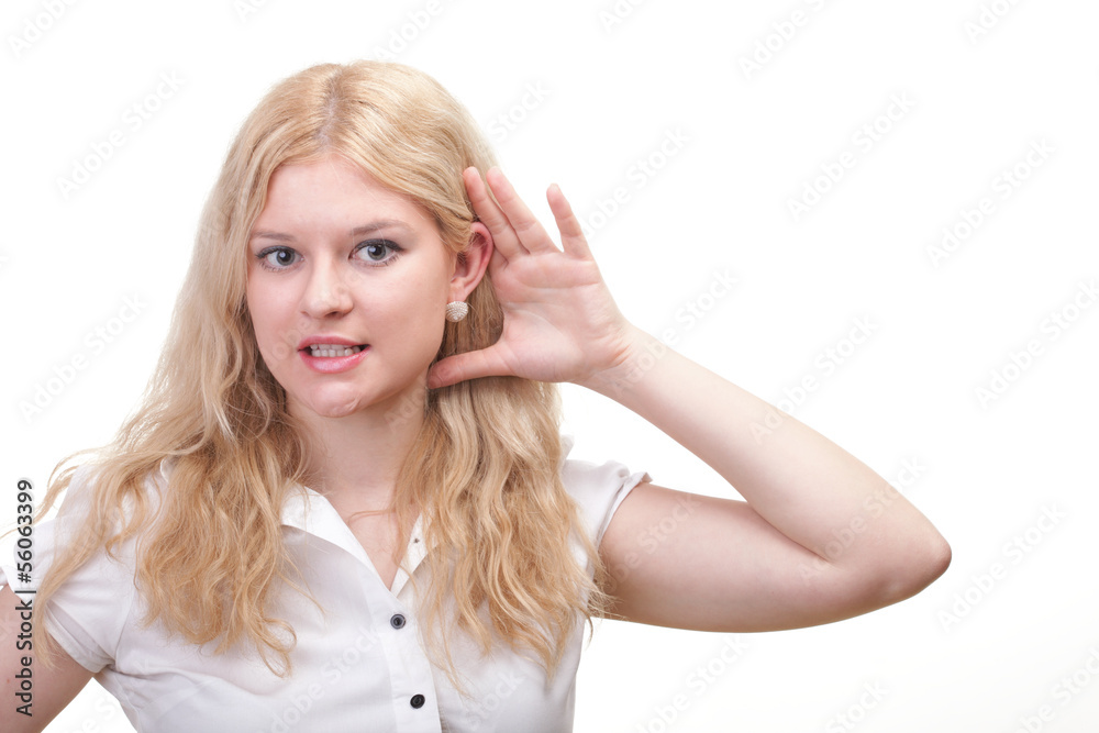 woman eavesdropping with hand behind her ear woman eavesdropping with hand behind her ear