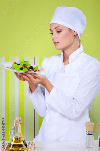 young chef woman prepare and decorating tasty food in kitchen photo