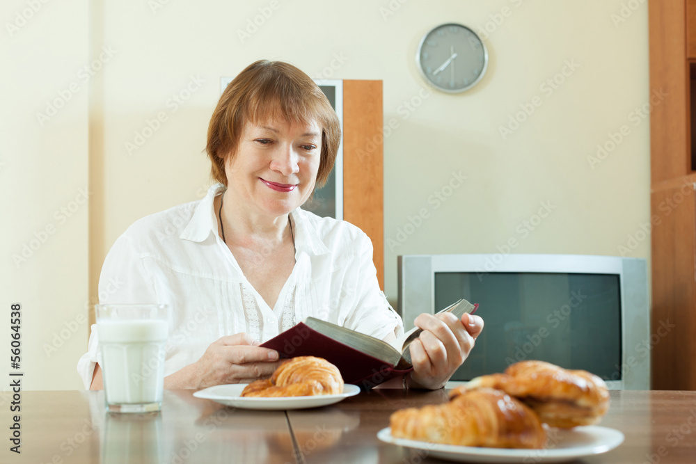 mature  woman having breakfast with milk