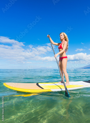 Woman on Stand Up Paddle Board © EpicStockMedia
