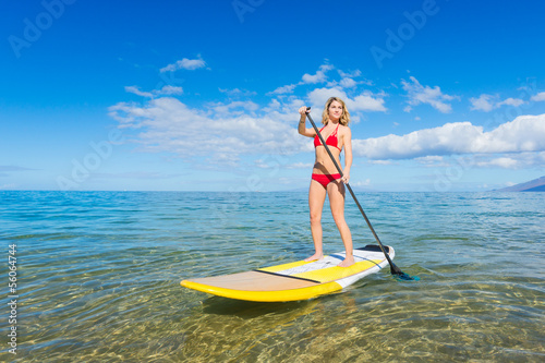 Woman on Stand Up Paddle Board © EpicStockMedia