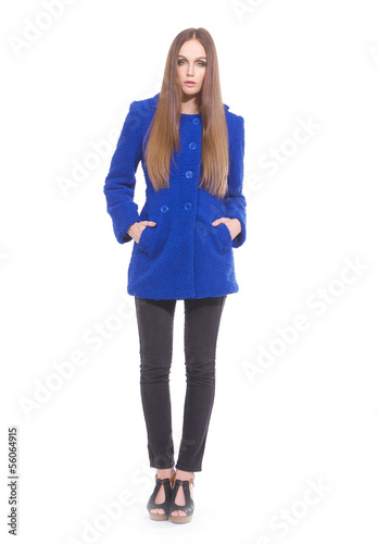 Full body attractive young girl in blue coat walking © inchic