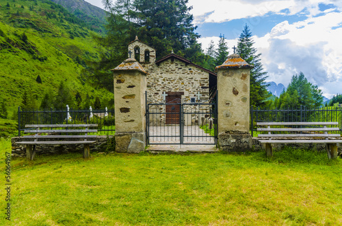 Rural Village cemetery with church in the Alps