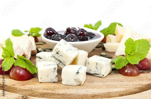 cheese plate with a large decorated the assortment of mint