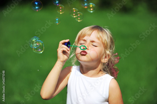 girl with bubble blower
