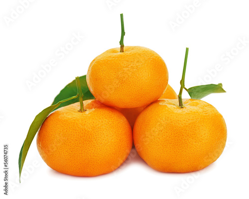 Fresh ripe tangerines with green leaves isolated on white backgr