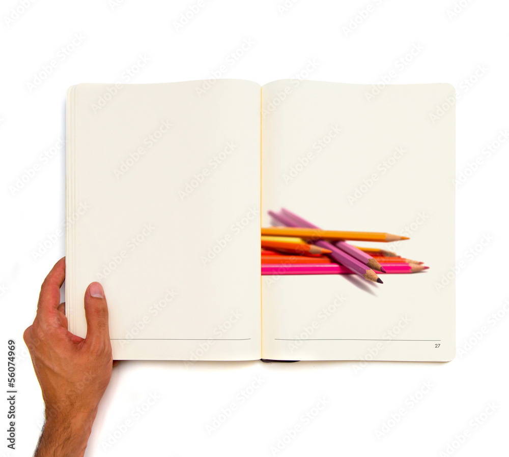 set of crayons printed on white book. set of crayons printed on white book.