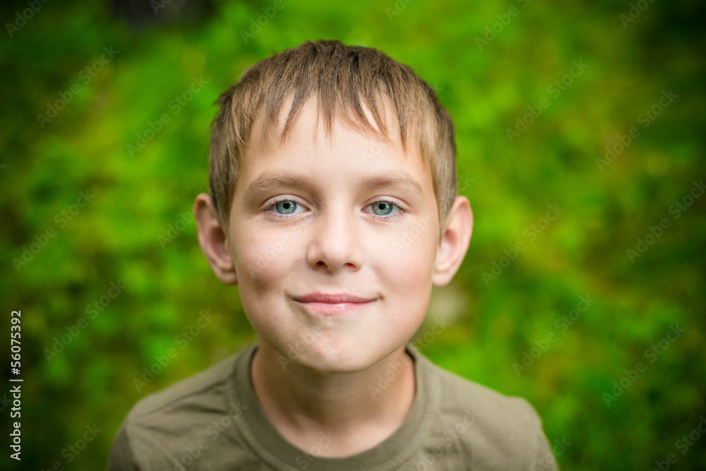 Close-up portrait of smiling little boy outdoors Close-up portrait of smiling little boy outdoors