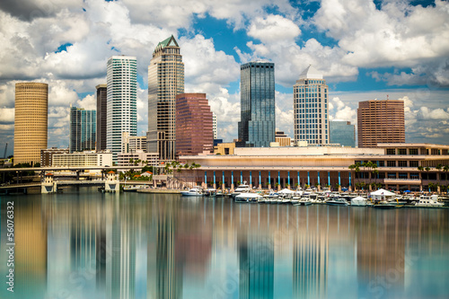 Tampa Florida skyline with sun,  clouds and reflections