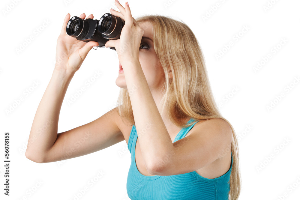 Side view of blond woman looking through binoculars Side view of blond woman looking through binoculars