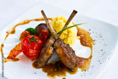 lamb steak  on white plate