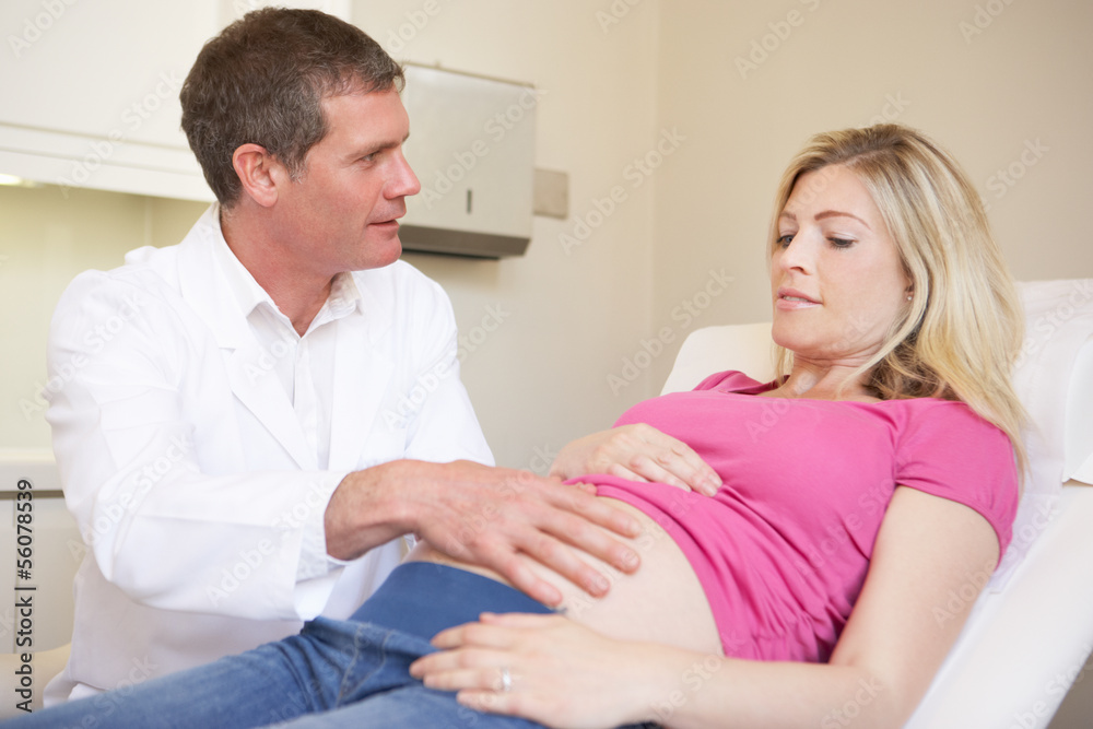 Pregnant Woman Being Given Ante Natal Check By Doctor Pregnant Woman Being Given Ante Natal Check By Doctor