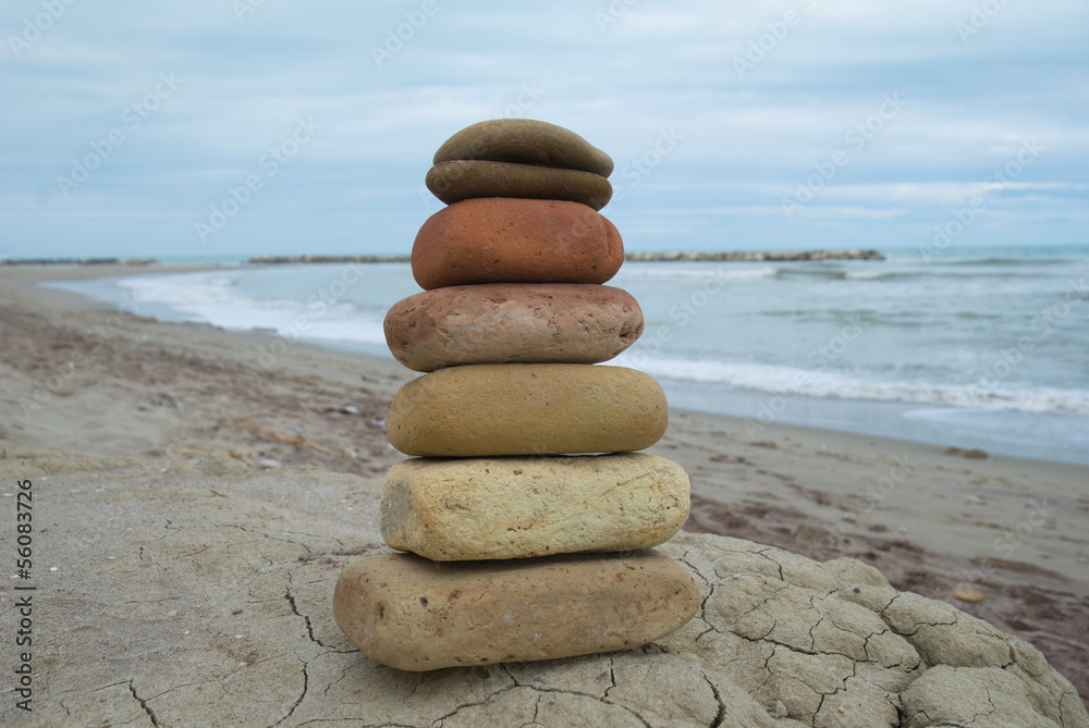 Fototapeta premium Zen stones stacked at beach