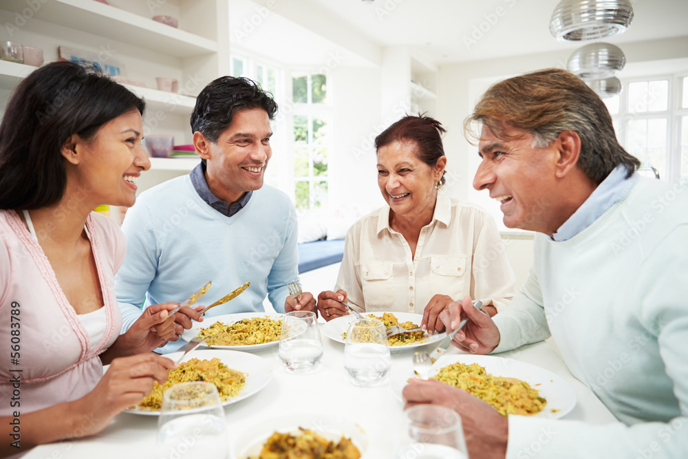 Indian Family Eating Meal At Home