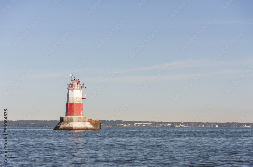Big marine sign or lighthouse in sea