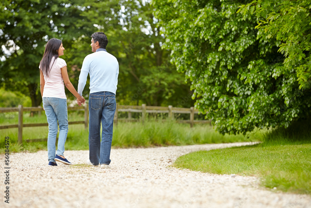 Indian Couple Walking In Countryside