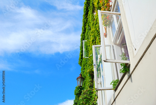Canvas-taulu White open window with street lamp and blue sky