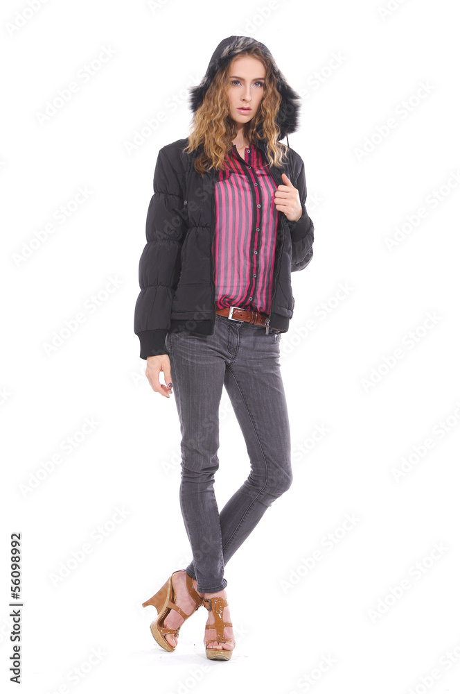 full length Fashion girl in jacket posing on gray background full length Fashion girl in jacket posing on gray background