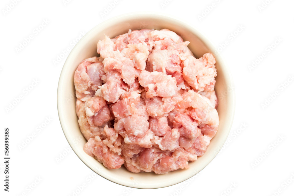 Minced pork in a bowl on a white background Minced pork in a bowl on a white background