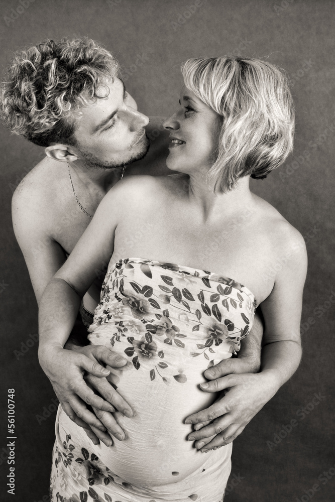 Loving happy couple, pregnant woman with her husband Loving happy couple, pregnant woman with her husband