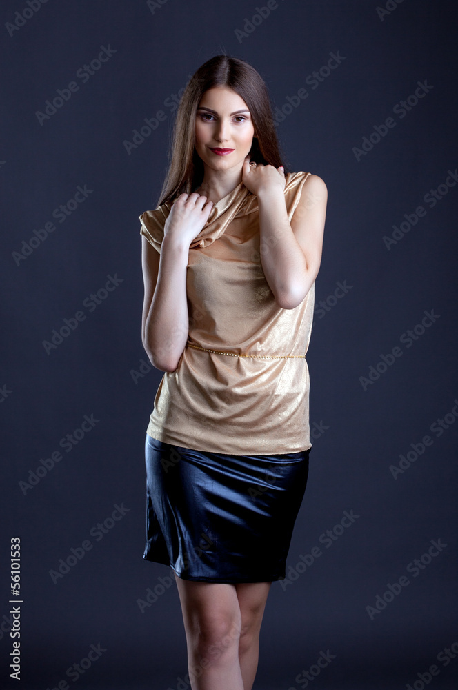 Portrait of smiling elegant model posing in studio Portrait of smiling elegant model posing in studio