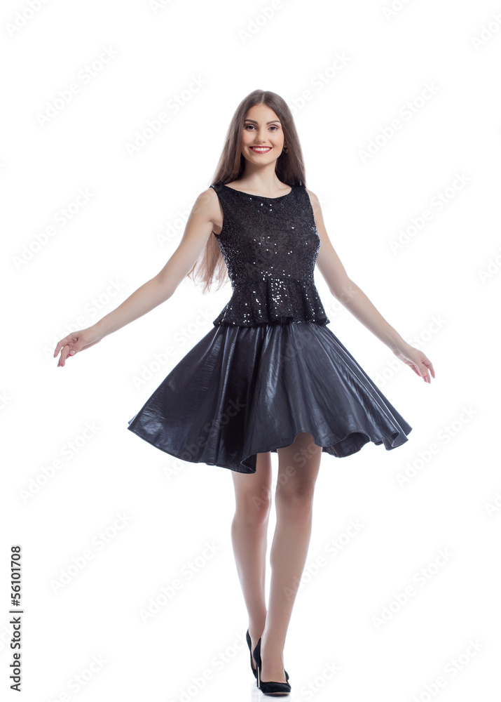 Cheerful sexy woman posing in stylish dress