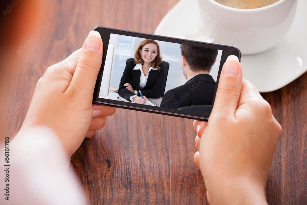 Woman Video Conferencing On Mobile Phone