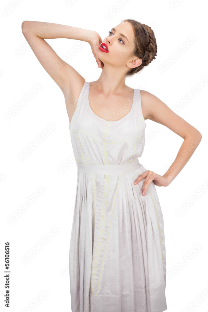 Sensual model in white dress posing looking away Sensual model in white dress posing looking away