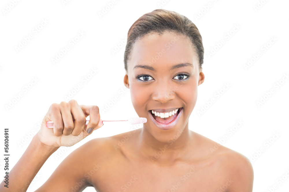 Smiling beautiful model holding toothbrush Smiling beautiful model holding toothbrush