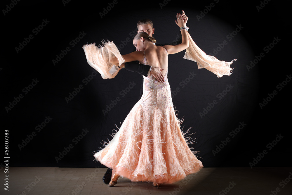 Fototapeta premium dancers in ballroom against black background
