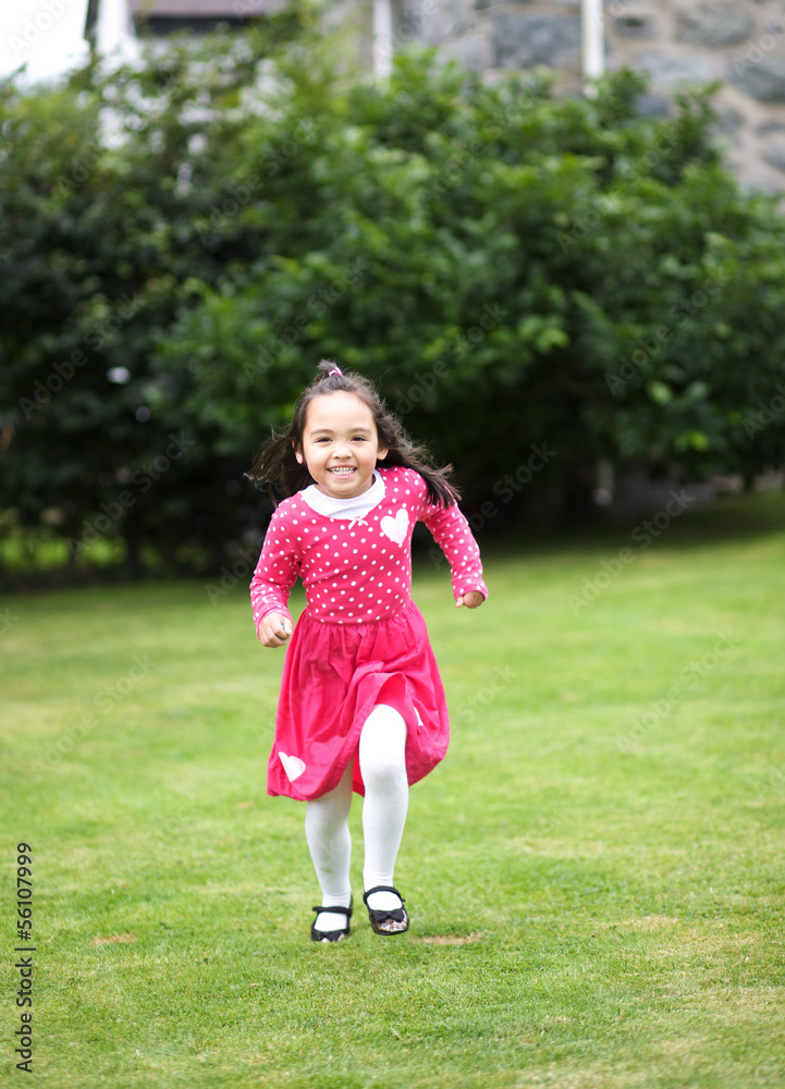 Fototapeta premium Happy asian child running in garden.